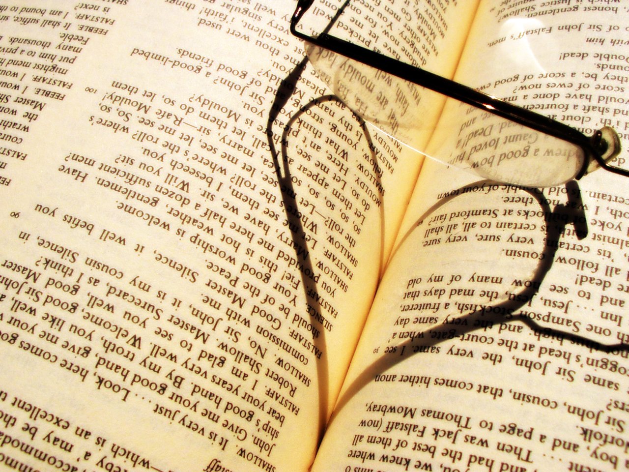 glasses heart on book